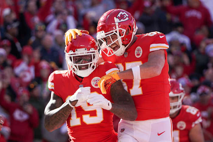Dec 12, 2021; Kansas City, Missouri, USA; Kansas City Chiefs wide receiver Josh Gordon (19) celebrates with tight end Travis Kelce (87) after scoring against the Las Vegas Raiders during the first half at GEHA Field at Arrowhead Stadium. Mandatory Credit: Denny Medley-USA TODAY Sports